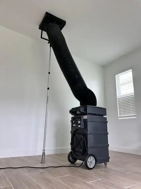 TOP 1 Air Duct Cleaning technician with professional vacuum equipment in an Orlando home